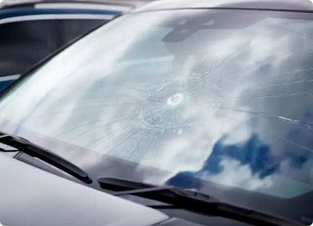damage to windscreen of car shattered